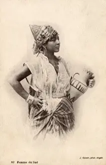 Pitcher Prints: Southern Algeria - Woman holding a small decorated ewer