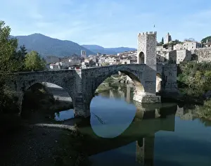 Symmetrical Prints: Spain. Catalonia. Besalu. Medieval bridge over the river Flu