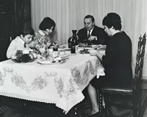 Maternity Collection: Spanish family sitting at the table at mealtime