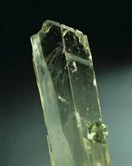 Spodumene crystal and cut stone