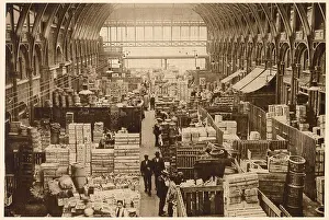 Indoors Prints: Stalls with wooden partitions selling fresh fruit wholesale. Date: 1937