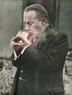 Images Dated 7th September 2016: Stanley Baldwin lighting his pipe