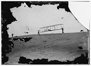 Start of a glide; Wilbur in motion at left holding one end o Start of a glide; Wilbur in motion at left holding one end o