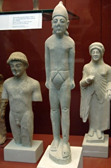 Images Dated 6th April 2008: Statue of a man wearing a pointed cap or helmet and a cyprio