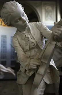 Instrument Prints: Statue of Wolfgang Amadeus Mozart (1756-1791) as a child pla