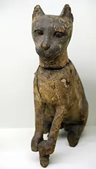 Divinity Prints: Statuette of a cat depicting goddess Bastet. Wood