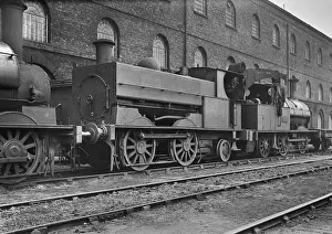 Steam engine at side of building