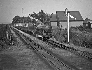 Steam engine and carriages on a railway track