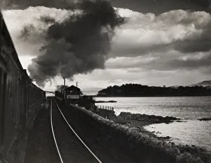 Steam train travelling up the east coast of England Steam train travelling up the east coast of England