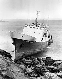 Caught Collection: Stern trawler Conqueror on rocks at Mousehole, Cornwall