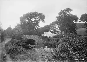 A stone arched bridge and building, Glenballyemon, Cushendal