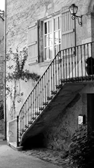 Stone staircase with wrought iron rail, France