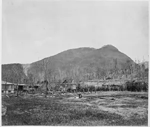 Storm damaged houses beside coast