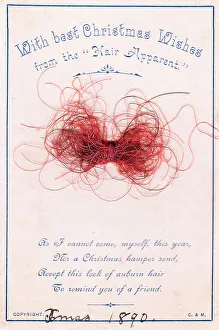 Strands of red hair with comic verse on a Christmas card