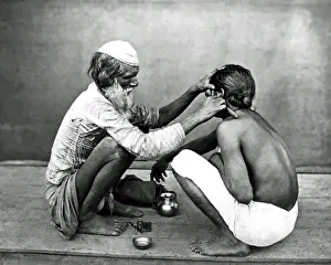 Razor Prints: Street barber at work, India