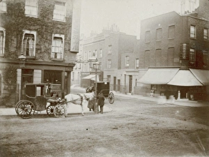 Street corner with horse-drawn carriages Street corner with horse-drawn carriages