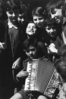 Accordion Gallery: Street music: accordion player, 1930s