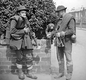 Bagpipes Prints: Street musicians with bagpipes and monkey