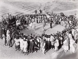 Street performers and large crowd, China. c. 1900