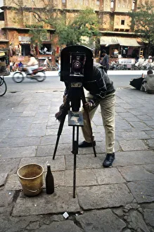 Street photographer outside the Palace of Winds, Jaipur Street photographer outside the Palace of Winds, Jaipur