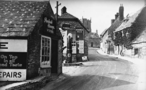 Garage Gallery: Street scene in Corfe Castle, Dorset