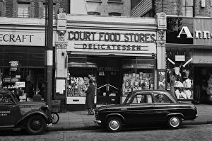 Shoppers Prints: Street scene with delicatessen, South London