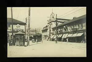 Tramlines Collection: Street scene with trams and shops, Kobe, Japan