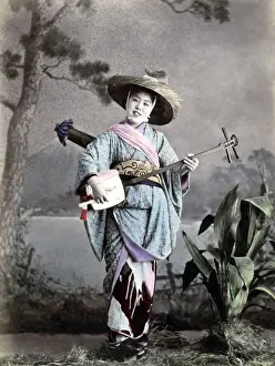 Street singer, Japan circa 1880s. Date: circa 1880s