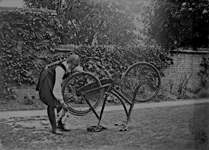 Student cleaning bicycle