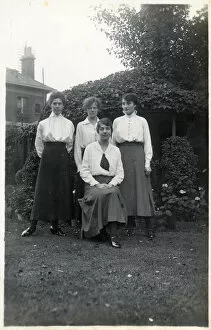 Four student friends posing for a group photograph