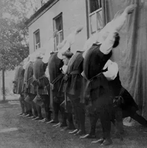 Students outside doing gym poses