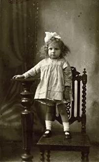 Images Dated 2nd January 2019: Studio photo of young girl standing on a chair