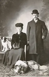 Muff Prints: Studio portrait, couple with two dogs