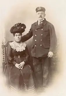 Studio portrait, Customs officer in uniform and wife