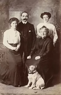 Images Dated 9th October 2015: Studio portrait, family of four with terrier dog