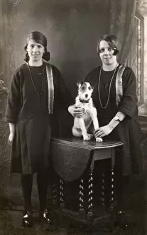 Packer Gallery: Studio portrait, two girls with terrier