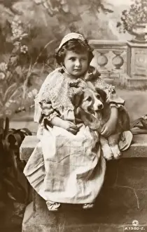 Studio portrait, little girl with her dog