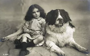Gingham Gallery: Studio portrait of little girl and large dog