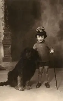 Shaggy Prints: Studio portrait, little girl with large dog, France