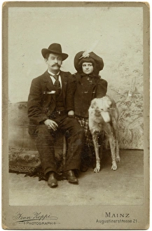 Studio portrait, man, girl and dog
