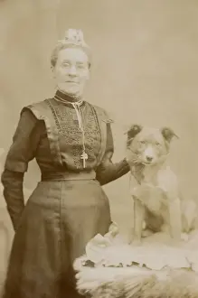 Studio portrait, middle aged woman with terrier