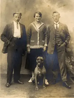 Informal Prints: Studio portrait, three people with boxer dog