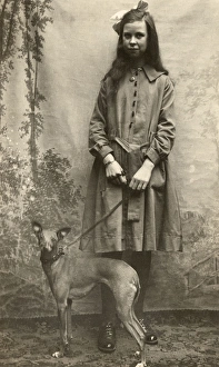 Studio portrait, tall girl with whippet