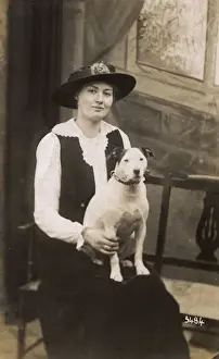 Studio portrait, woman with bull terrier