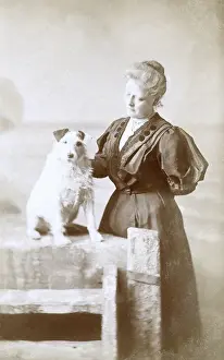 Studio portrait, woman with dog