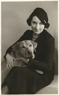 Studio portrait, woman with dog