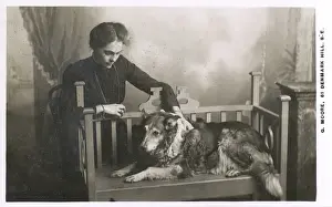 Nellie Prints: Studio portrait, woman with dog on bench