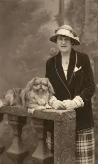 Lapdog Prints: Studio portrait, woman with Pekingese dog