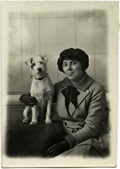 Alert Gallery: Studio portrait, woman with terrier dog