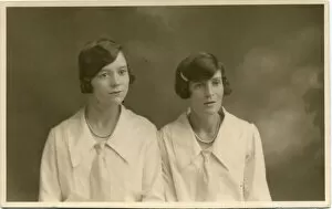 Identical Gallery: Studio portrait of two women, both with their dark hair bobbed